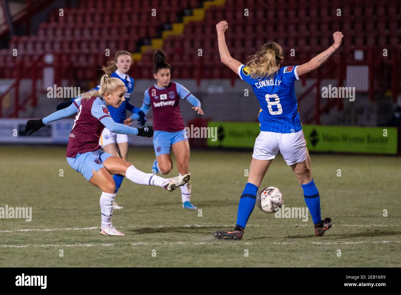 Crawley, UK. 10th Feb, 2021. Adriana Leon (#19 West Ham United) strikes for goal but is blocked by Megan Connolly (#8 Brighton & Hove Albion) during the Women's Super League match between Brighton and Hove Albion and West Ham United at The People's Pension Stadium in Crawley. Credit: SPP Sport Press Photo. /Alamy Live News Stock Photo