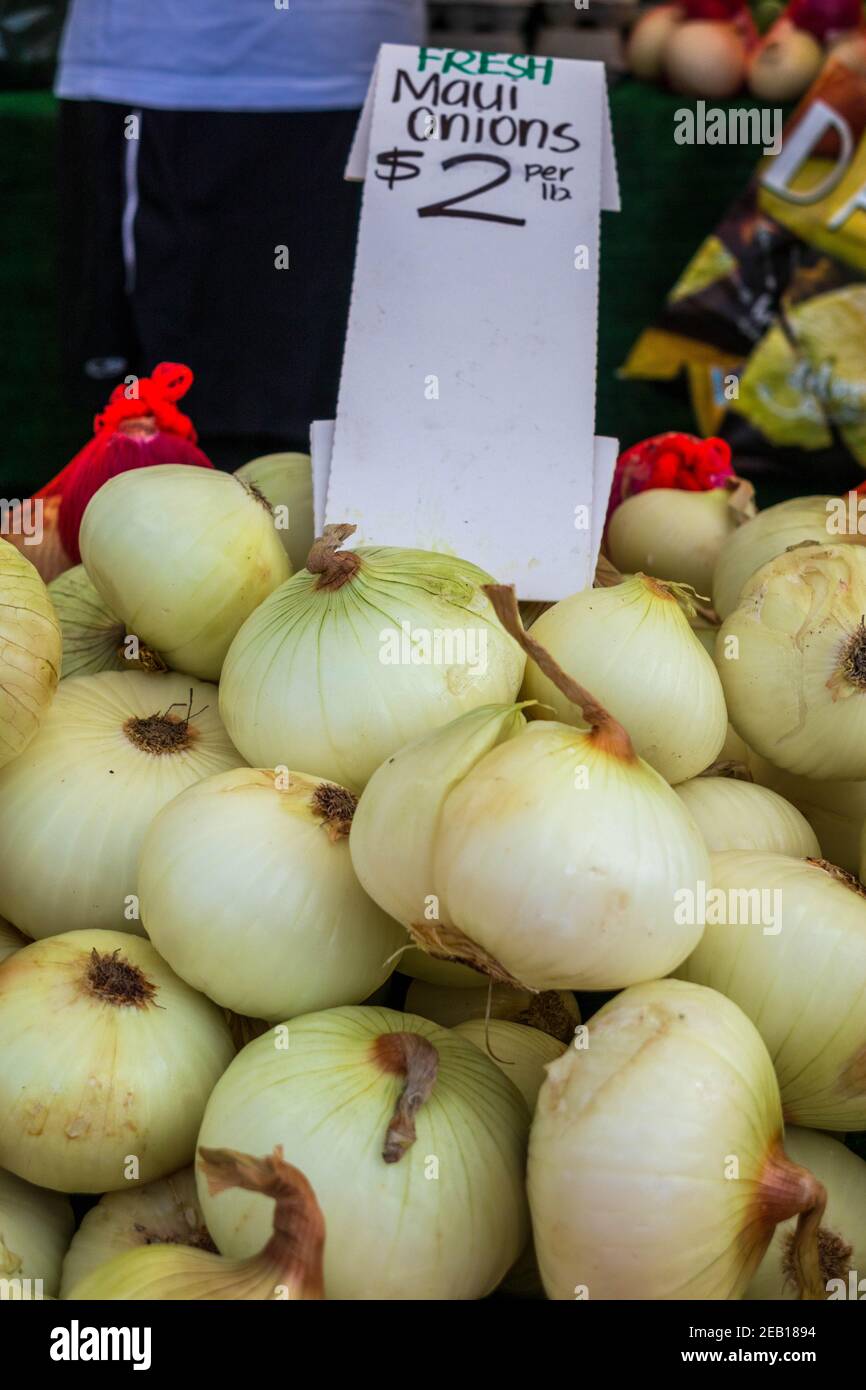 Maui onions, sweet onions for sale on a market stall close up with price sign Stock Photo