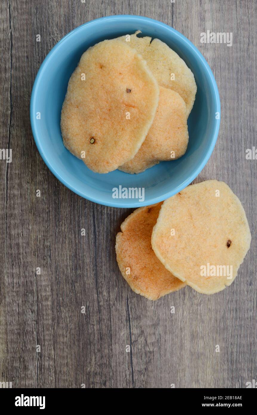 Crispy shrimp chips, prawn cracker krupuk in a bowl top view Stock