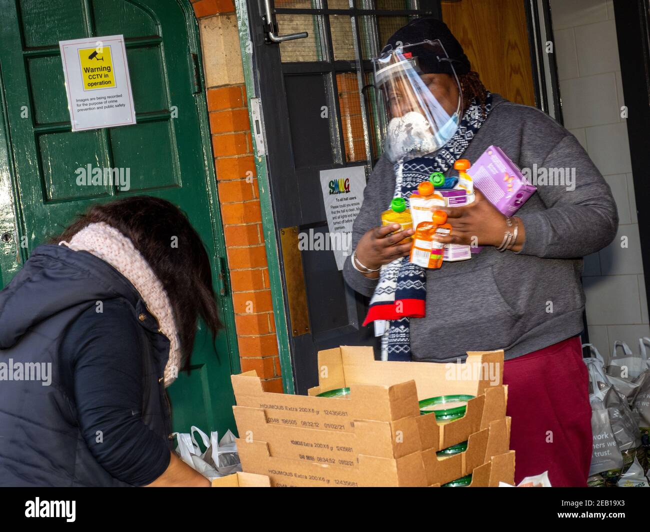 Volunteers serving food bank hi-res stock photography and images - Alamy