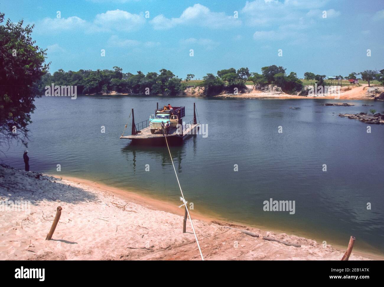 APURE STATE, VENEZUELA - Truck on river ferry pulled by hand across Cano La Pica River. Stock Photo