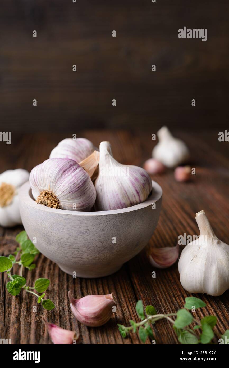 Natural antibiotic, fresh garlic bulbs with cloves on rustic wooden background with copy space Stock Photo