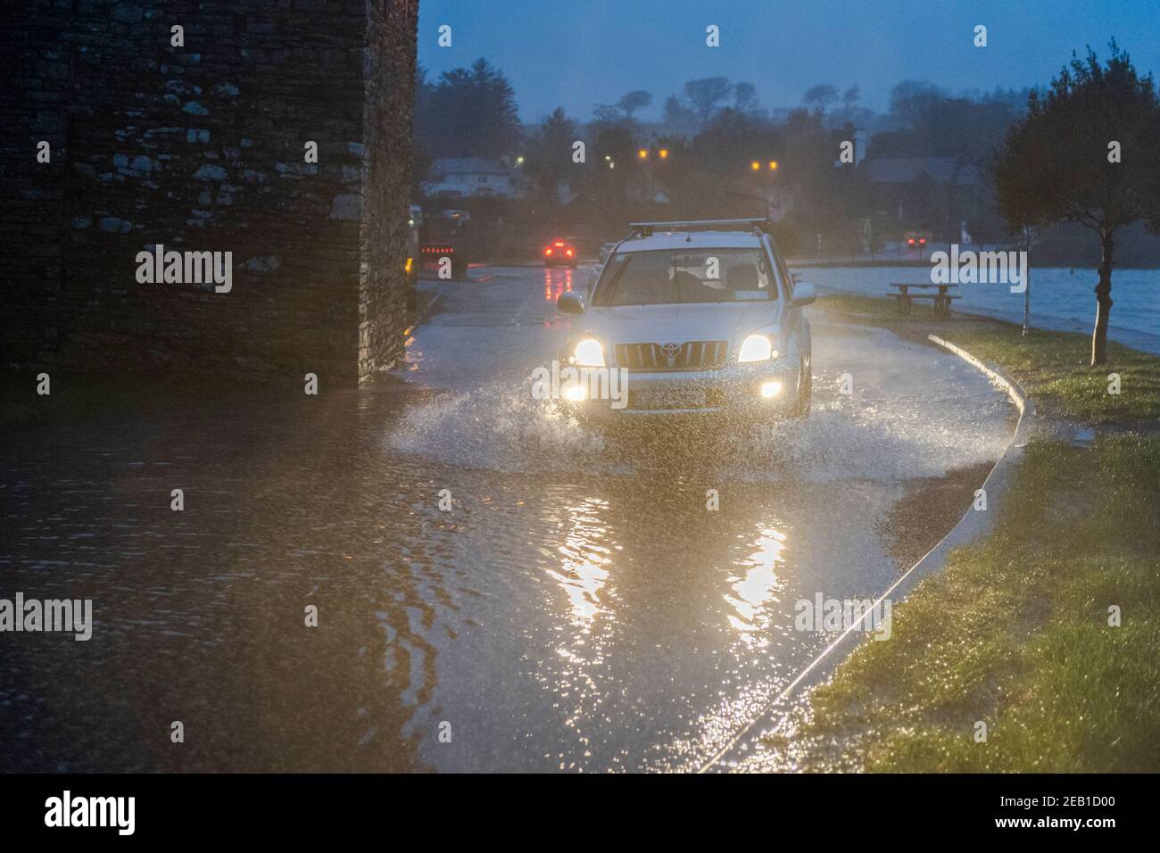 Timoleague, West Cork, Ireland. 11th Feb, 2021. After a day of torrential rain and winter showers, the road under Timoleague Abbey flooded at high tide this evening. Credit: AG News/Alamy Live News Stock Photo
