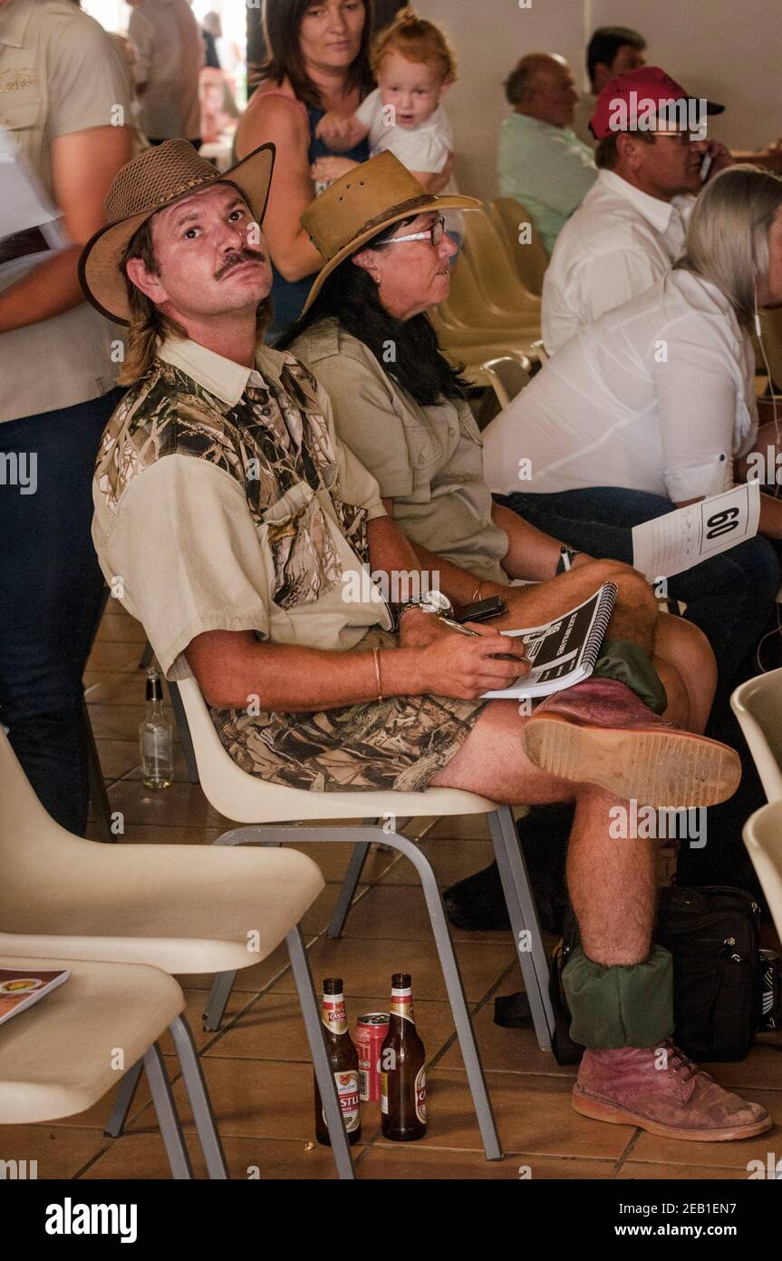 Wildlife ranch manager Berdus Henrico (front center) monitors prices during a wildlife auction at Mpatamacha wildlife auction venue near Melkrivier, L Stock Photo