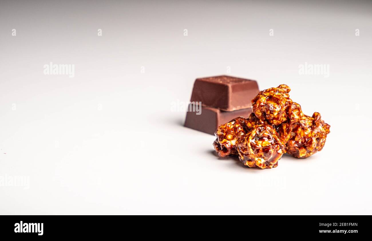 Chocolate popcorn on a white background. Stock Photo