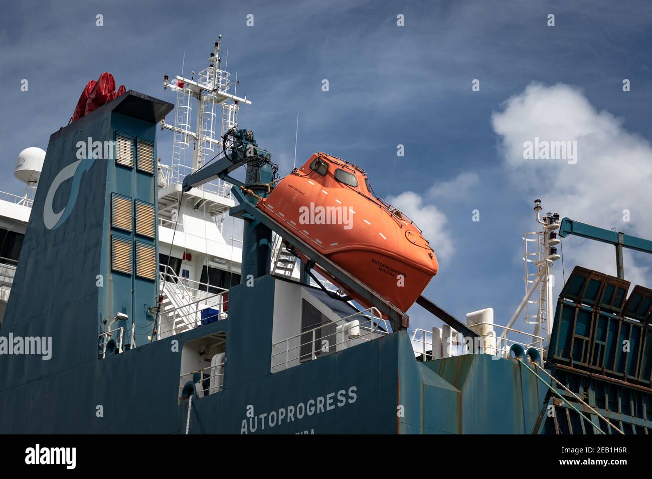 Orange Self Righting Lifeboat Aboard the 'AUTOPROGRESS' Vehicle Carrier Ship Moored at Falmouth Cornwall England Stock Photo