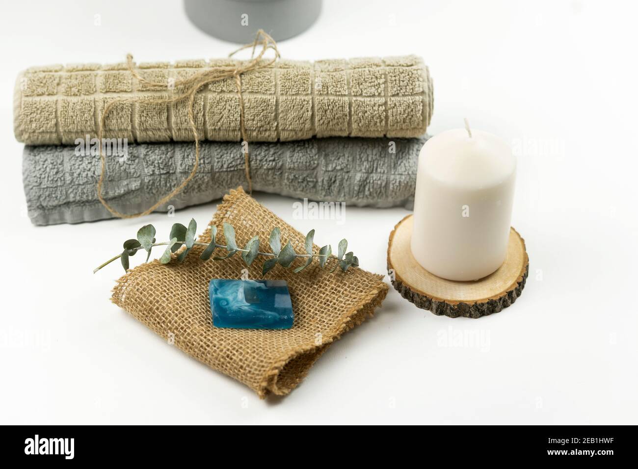 Cotton towels of neutral colour lie on a table in a modern bathroom Stock Photo