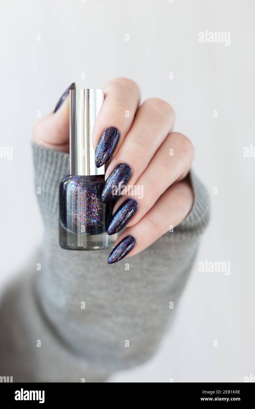 Fingers gesture with purple nail polish on blouse rare