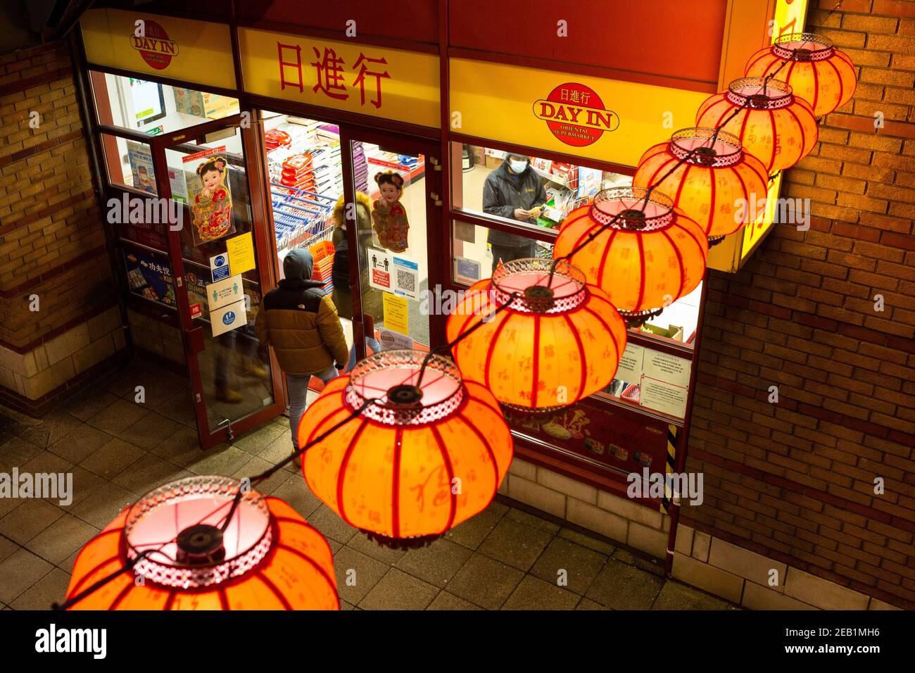 Birmingham, UK. 11th Feb, 2021. Chinese New Years Eve. A normally vibrant and crowded Chinese Quarter in Birmingham, UK, is unusually quiet as Chinese communities in the city are forced to celebrate the New Year on Friday at home. People shop for normal amounts due to lockdown. Credit: Peter Lopeman/Alamy Live News Stock Photo