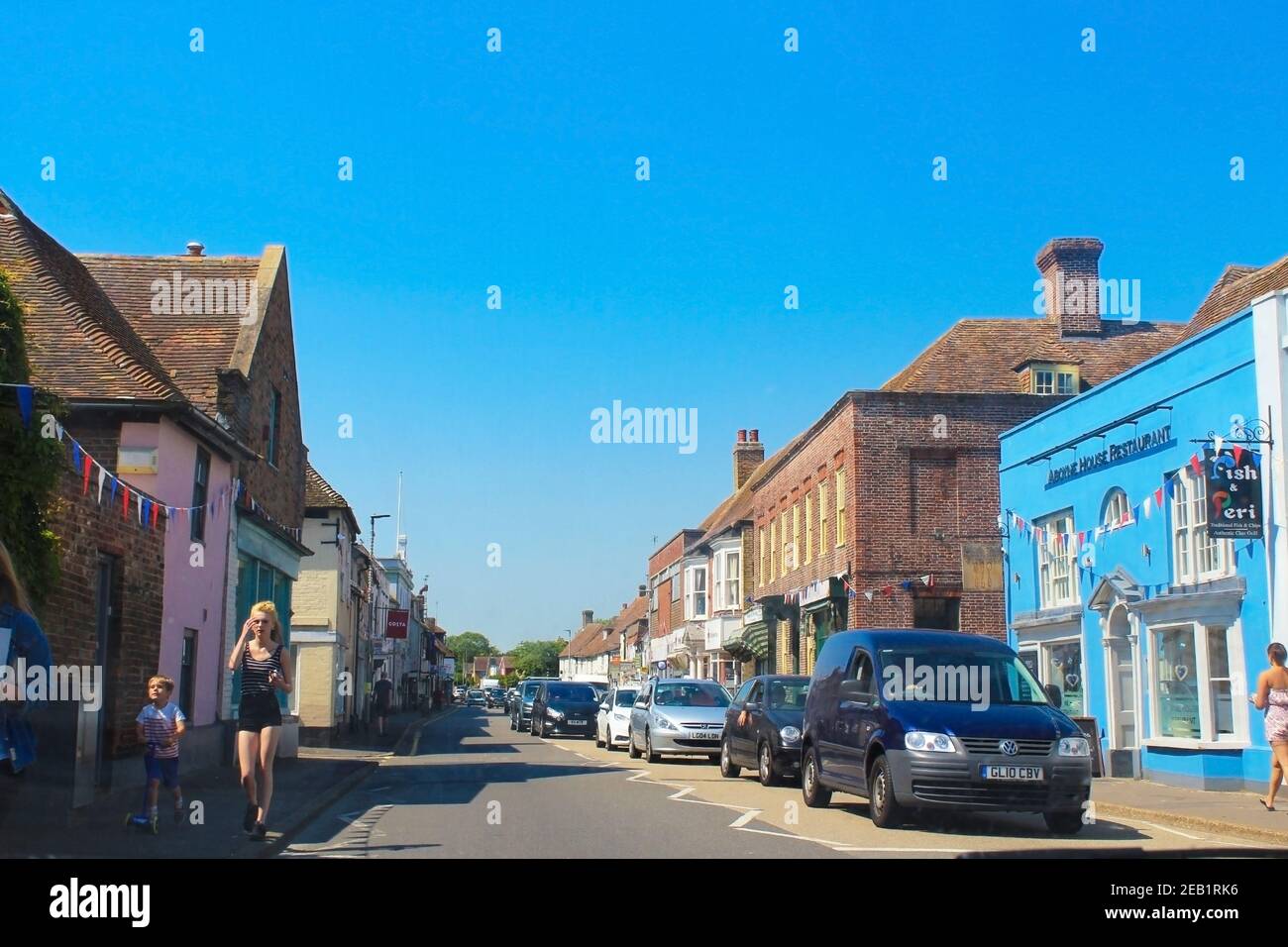 High street of Dymchurch on sunny summer day against nice blue sky, A