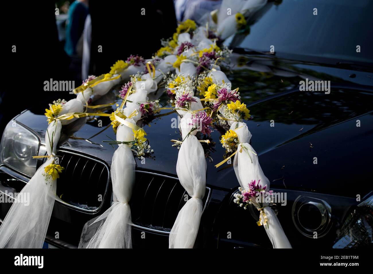 Closeup view on flower decoration on modern wedding car Stock Photo - Alamy