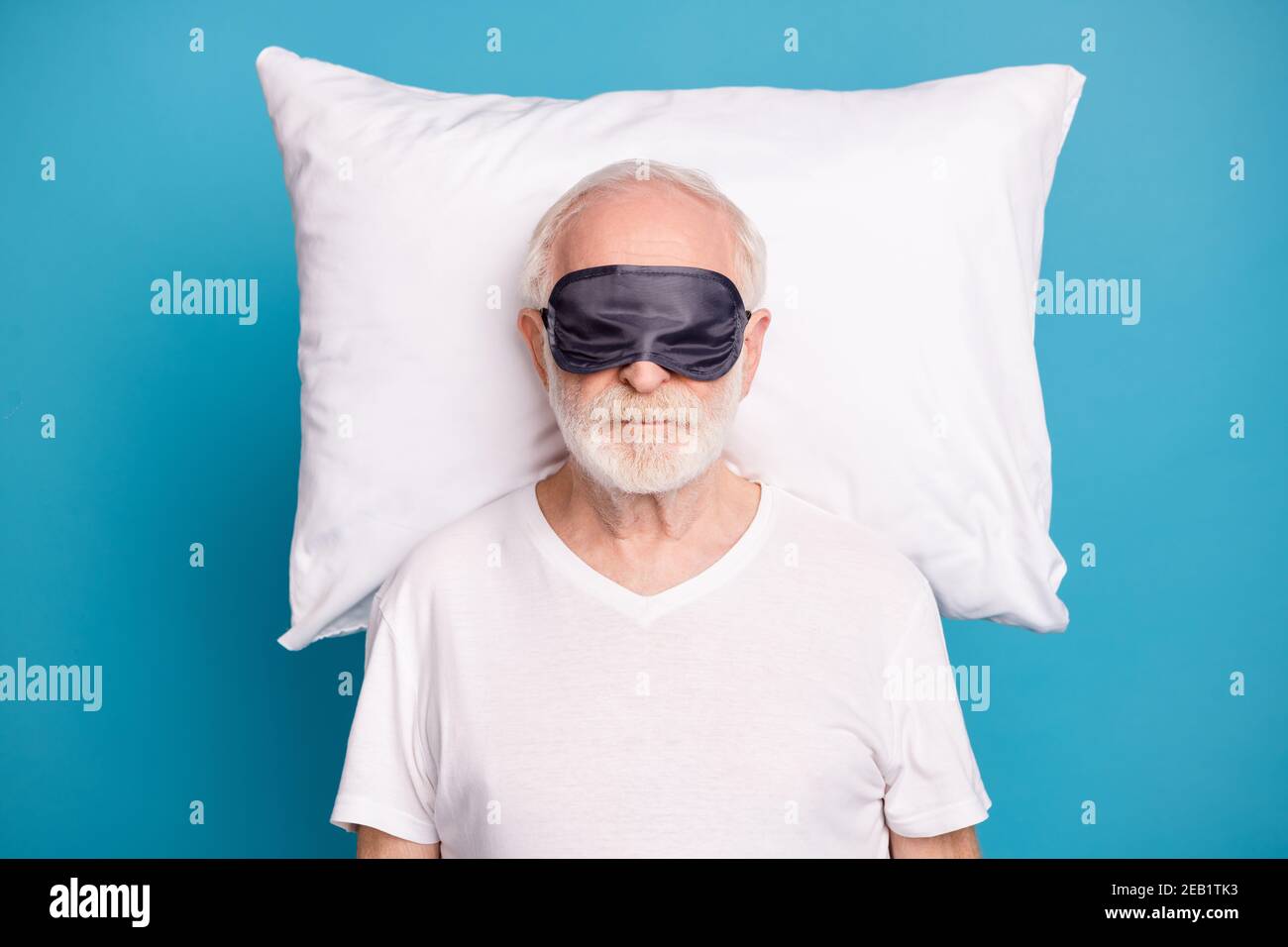 Photo of handsome aged person wear sleep mask cover eyes sleeping