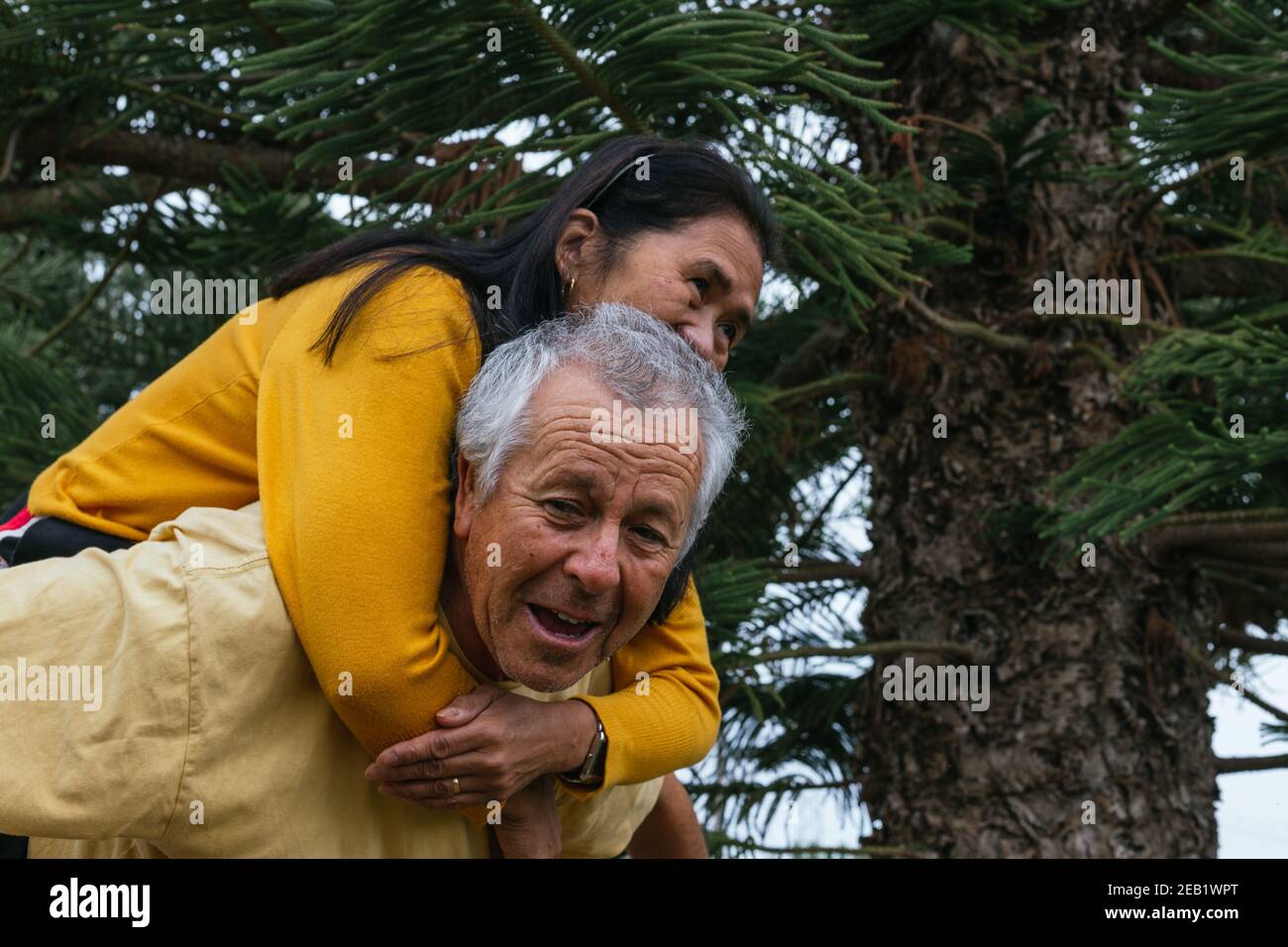 Happy old interracial couple having fun together Stock Photo