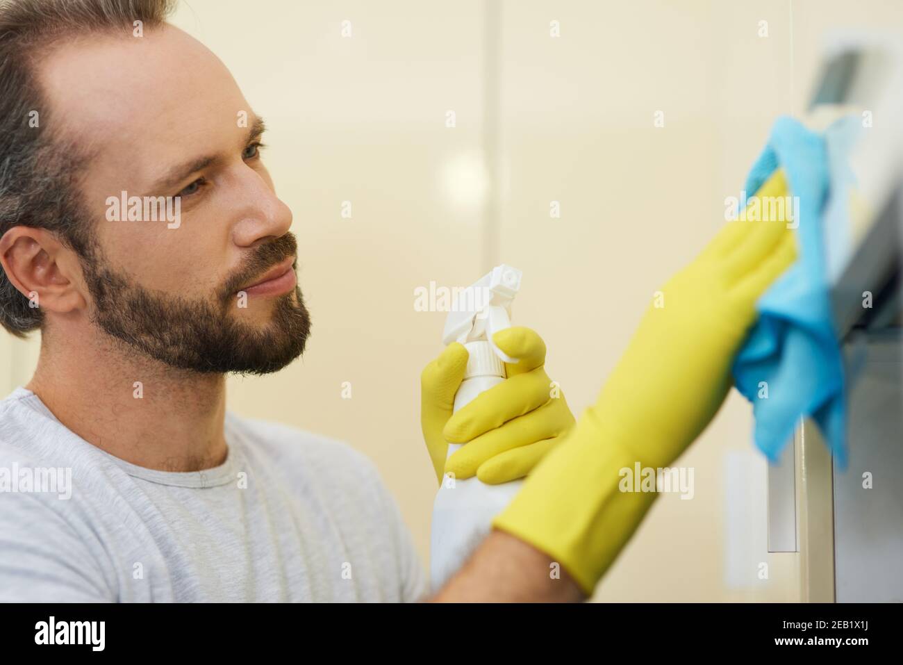 Excellent cleaning. Portrait of professional male cleaner wearing