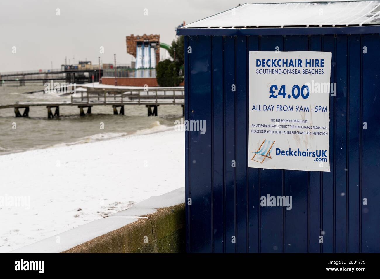 Deckchair hire storage shed, business, in Southend on Sea, Essex, UK, with snow from Storm Darcy. Out of season seaside business Stock Photo