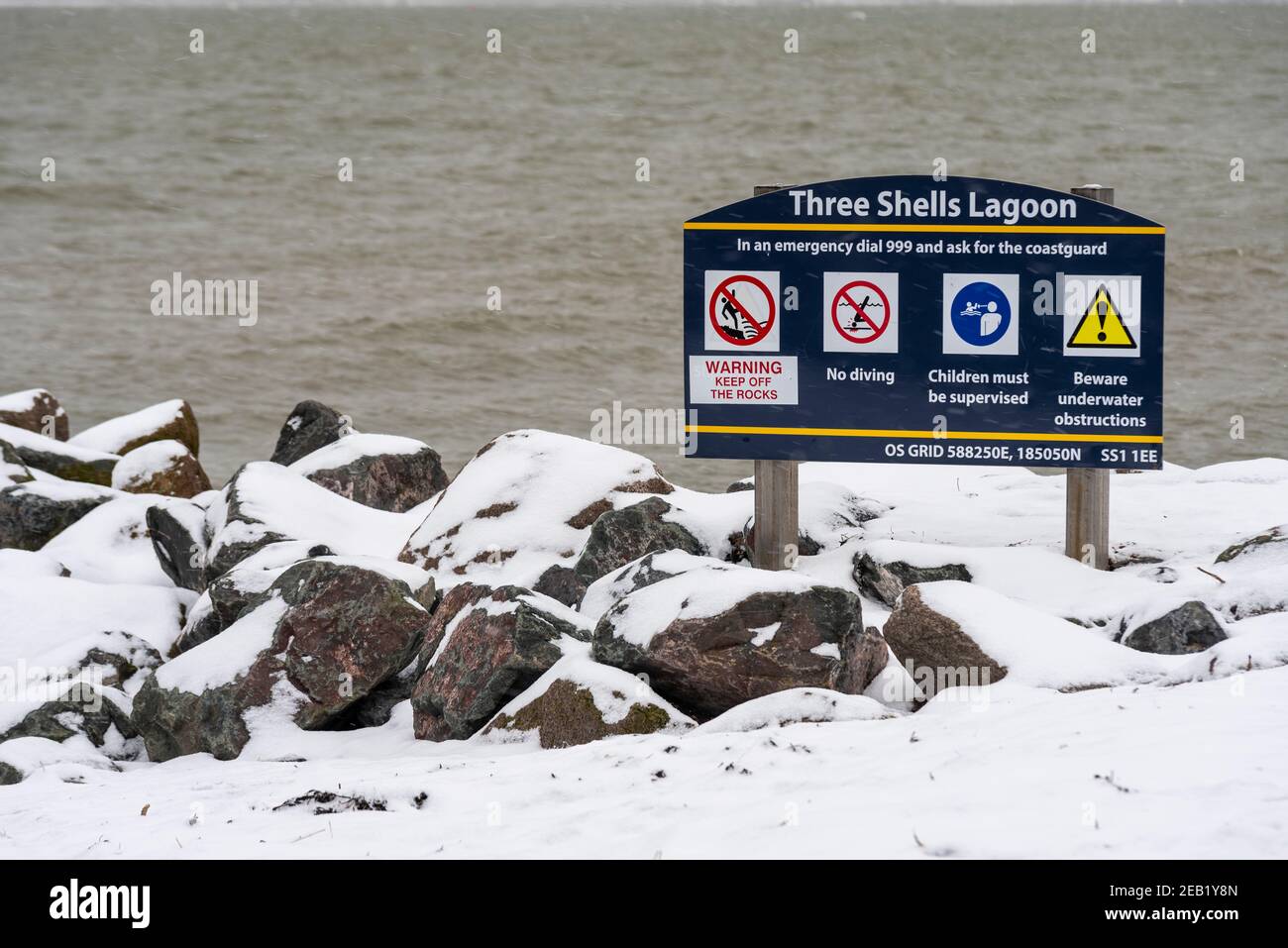 Three Shells Lagoon man made saltwater swimming pool in Southend on Sea, Essex, UK, with snow from Storm Darcy. Grim weather Stock Photo