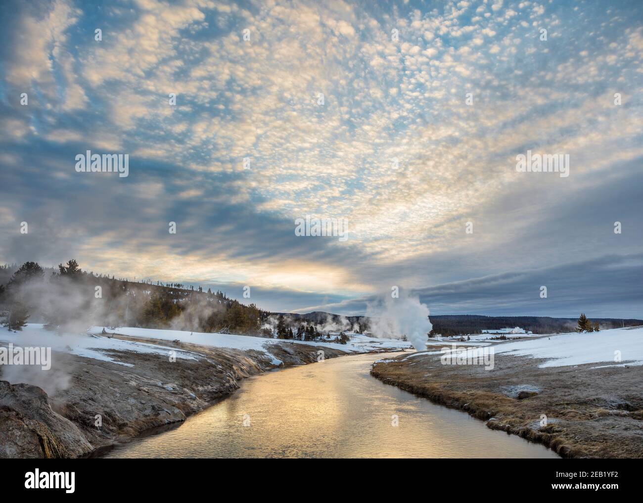 Yellowstone National Park, WY: Sunrise clouds over the Firehole River in the Upper Geyser Basin Stock Photo