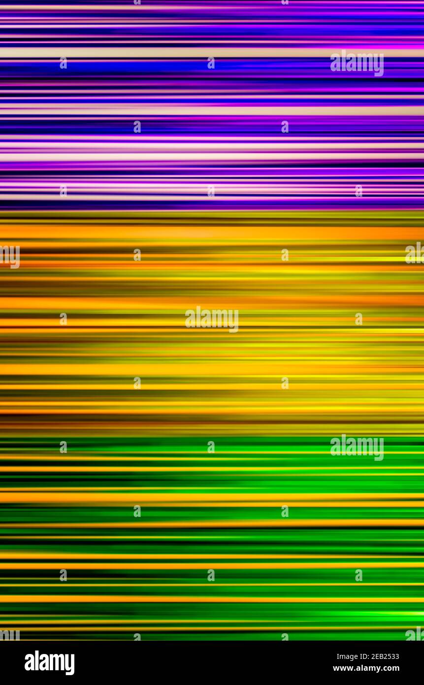 Mardi Gras streamers create an abstract background of purple, gold, and green stripes, Feb. 8, 2021, in Mobile, Alabama. Stock Photo