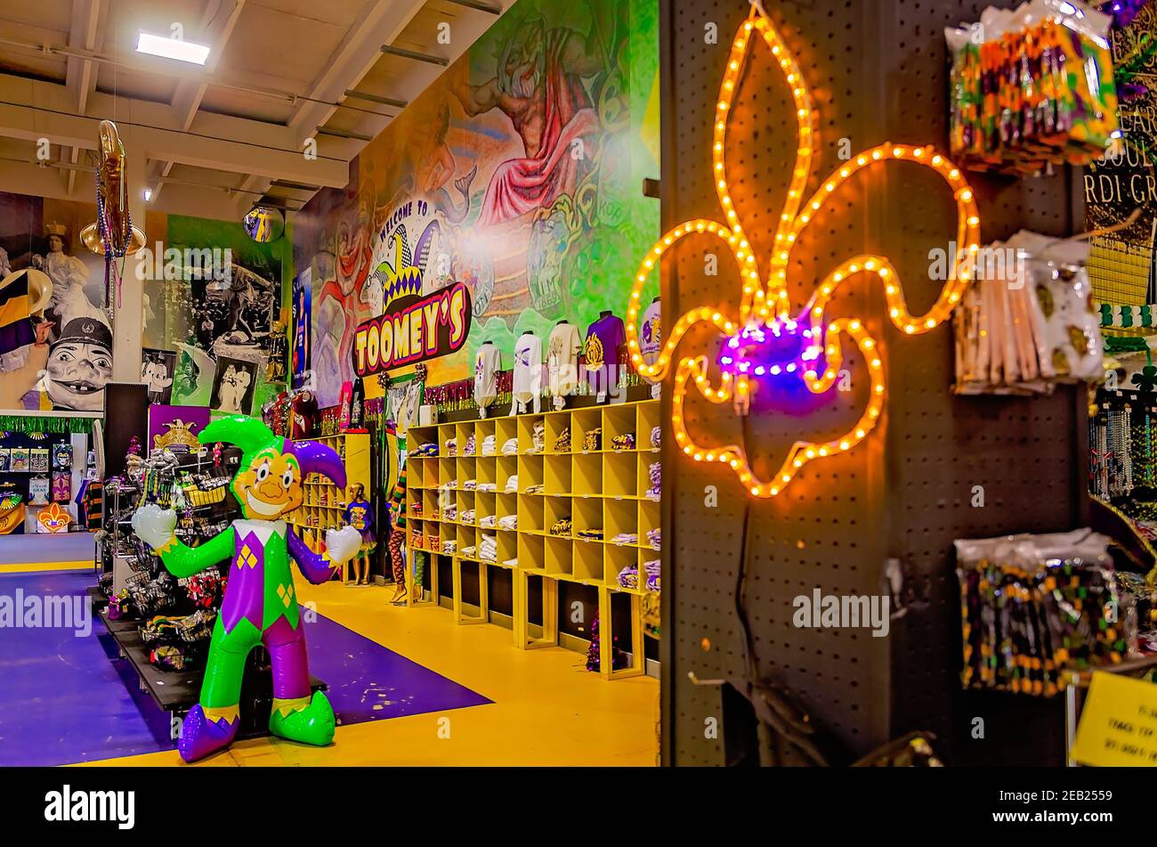 A lighted fleur-de-lis and inflatable jester are among the Mardi Gras  decorations for sale at Toomey's Mardi Gras shop in Mobile, Alabama Stock  Photo - Alamy