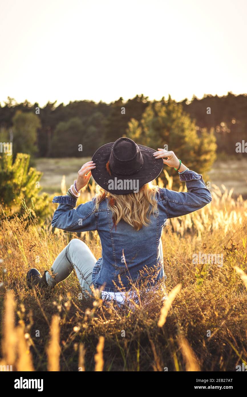 Flat-lay of vintage denim jacket, sweater, jeans, woolen scarf, hat, yellow  boots, glasses, pumpkin, - Free Photo (0Wkox0) - Noun Project