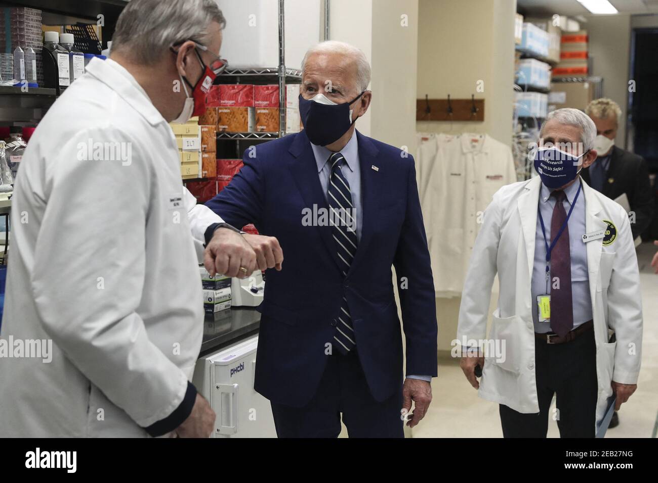 President Joe Biden greets Barney Graham, left during a visit at the ...