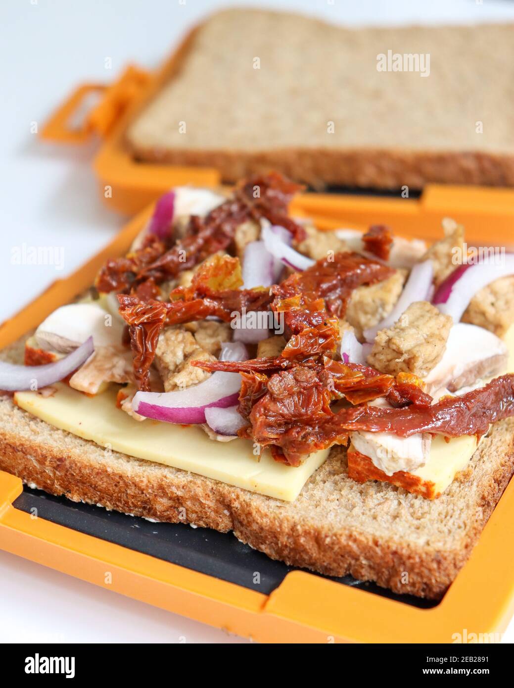 https://c8.alamy.com/comp/2EB2891/morphy-richards-mico-toastie-toasted-sandwiches-microwave-cookware-kitchen-food-preparation-cooking-snack-grilled-sandwich-ve-2EB2891.jpg