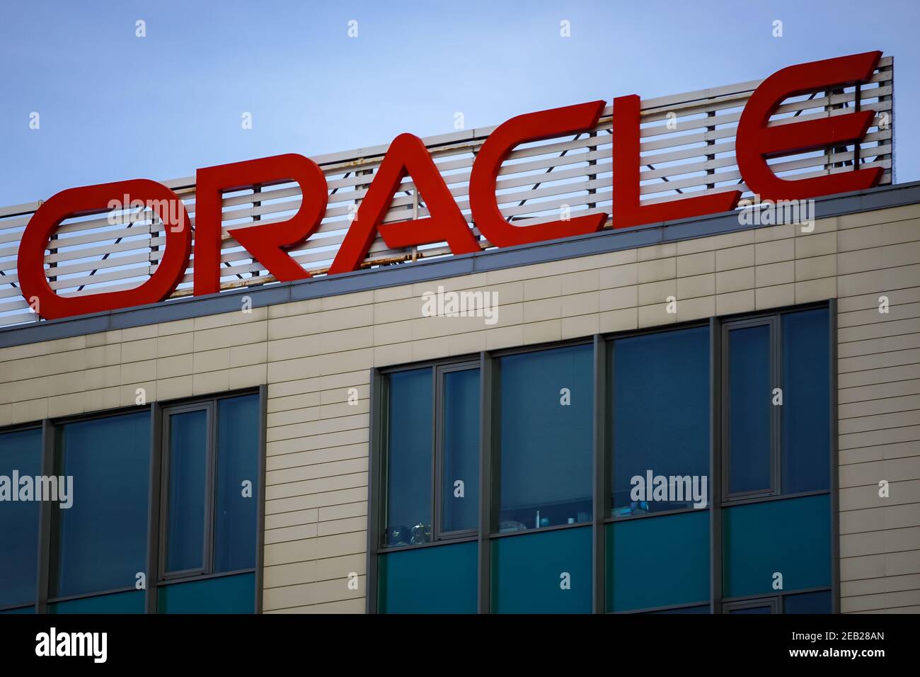 Bucharest, Romania - January 21, 2021: Oracle logo is seen on top of Oracle Tower B building, near Pipera bridge, in Bucharest, Romania. This image is Stock Photo