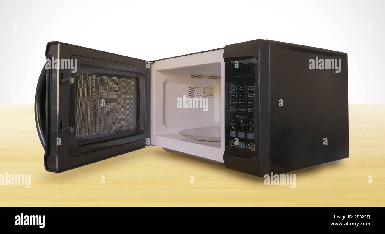 Black Microwave with Door Open on Wooden Countertop Stock Photo Alamy