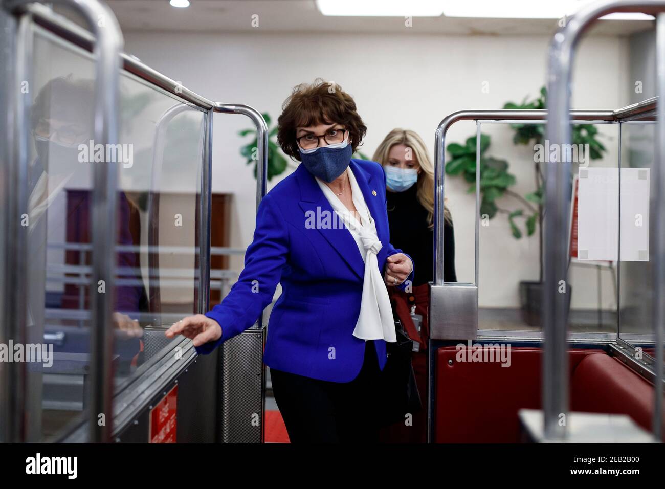 Senator Jacky Rosen, a Democrat from Nevada, wears a protective mask while boarding the Senate Subway at the U.S. Capitol in Washington, D.C., U.S., on Thursday, Feb. 11, 2021. House prosecutors used the second day of Donald Trump's impeachment trial to detail a months-long campaign by the former president to stoke hatred and encourage violence over the election results that they said culminated in the mob attack on the U.S. Capitol that he then did little to stop. Credit: Ting Shen - Pool via CNP | usage worldwide Stock Photo
