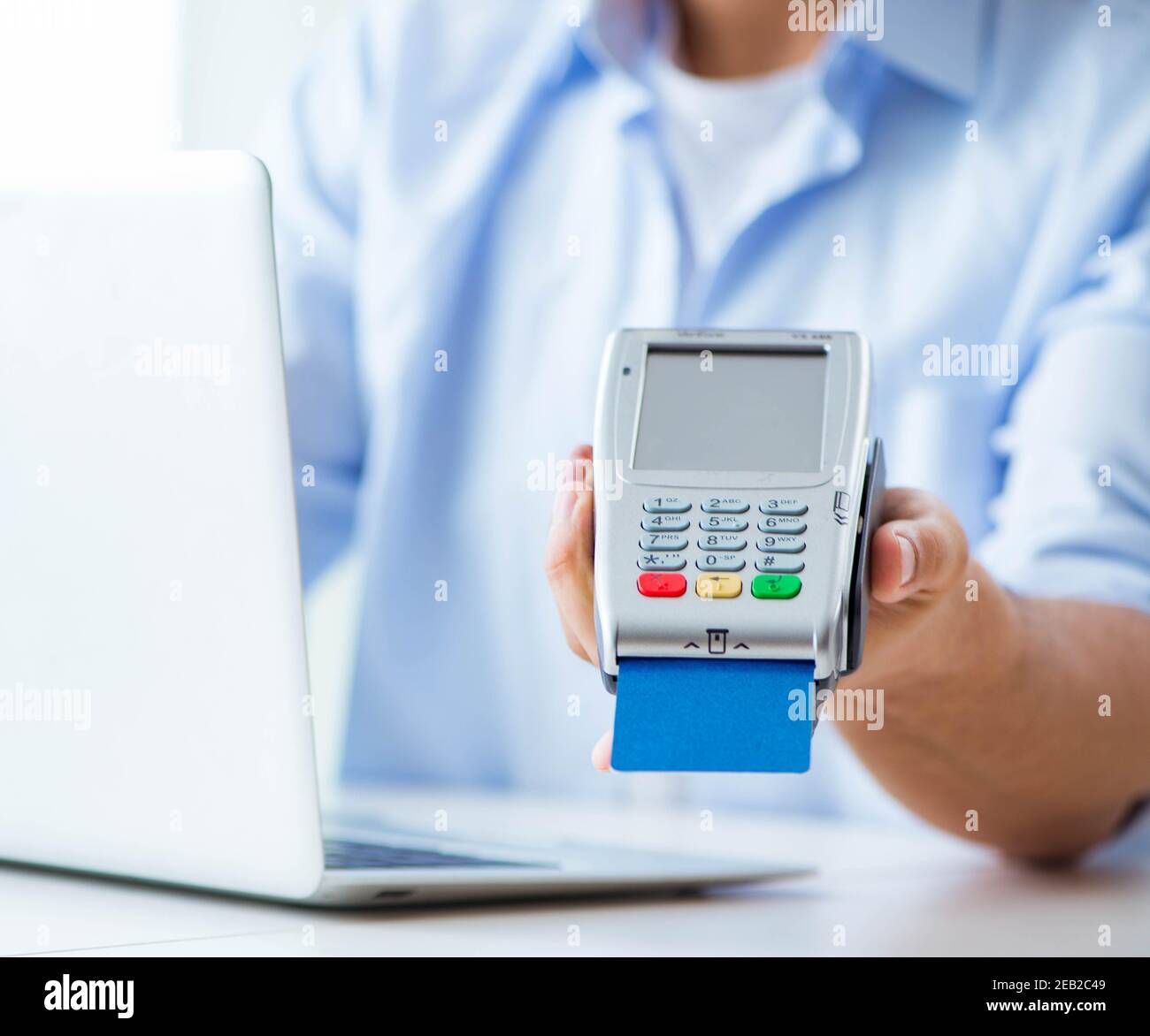 The man processing credit card transaction with pos terminal Stock ...