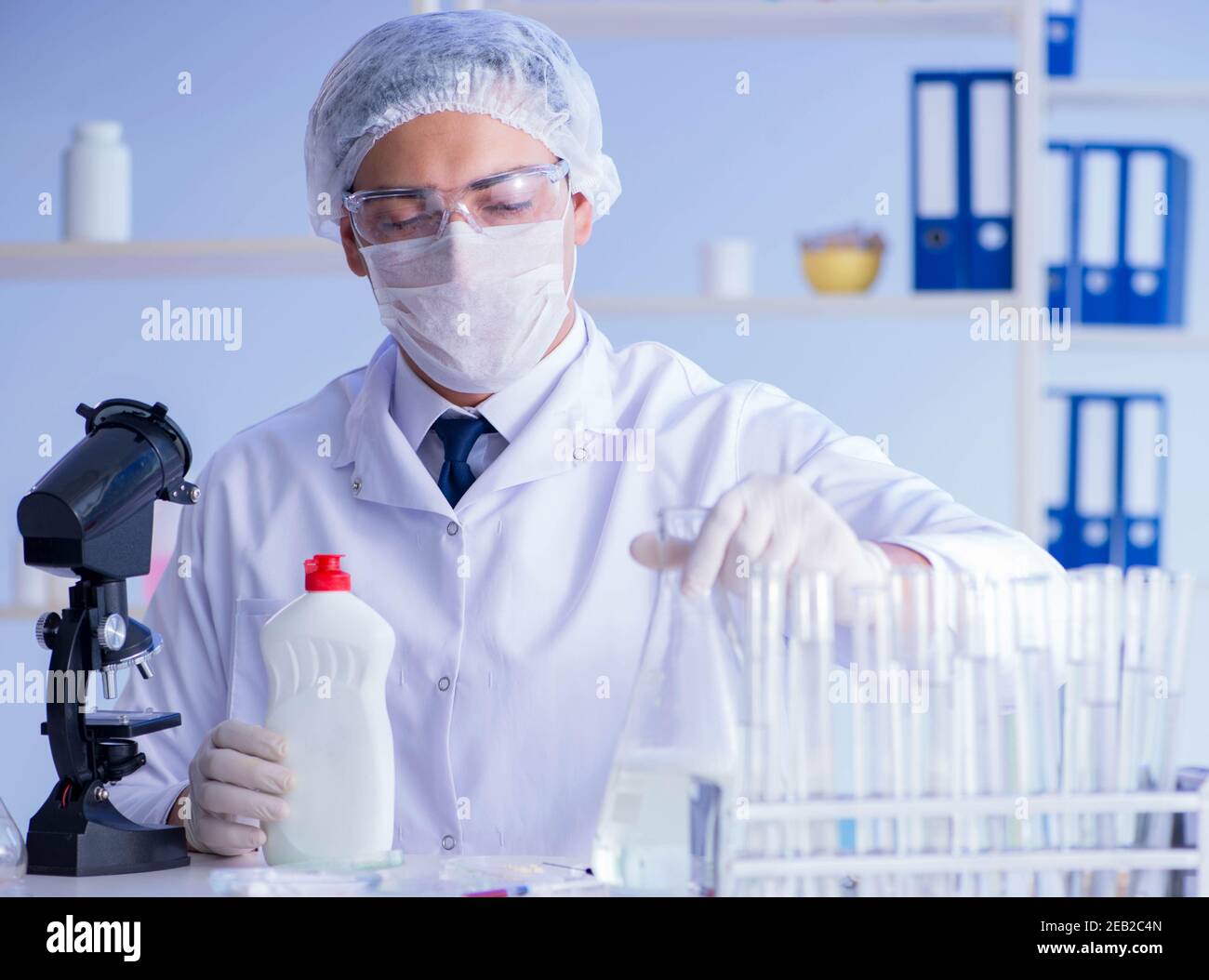 The man in the lab testing new cleaning solution detergent Stock Photo