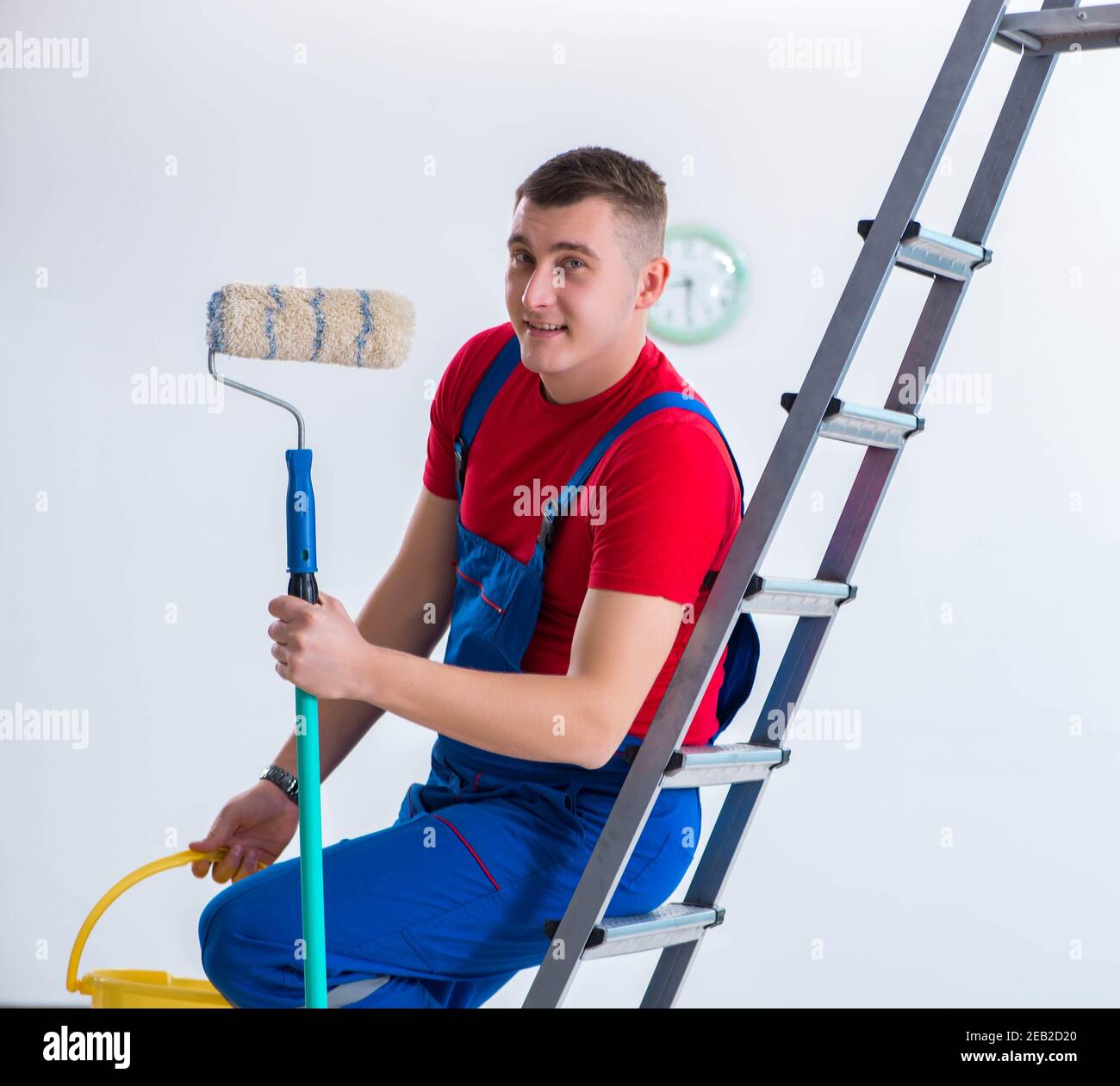 The male painter preparing for painting job at construction site Stock