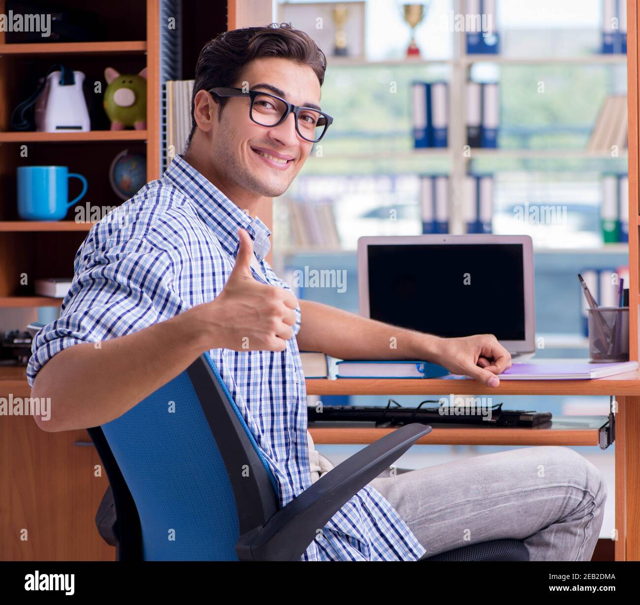 The student studying at home preparing for exam Stock Photo - Alamy