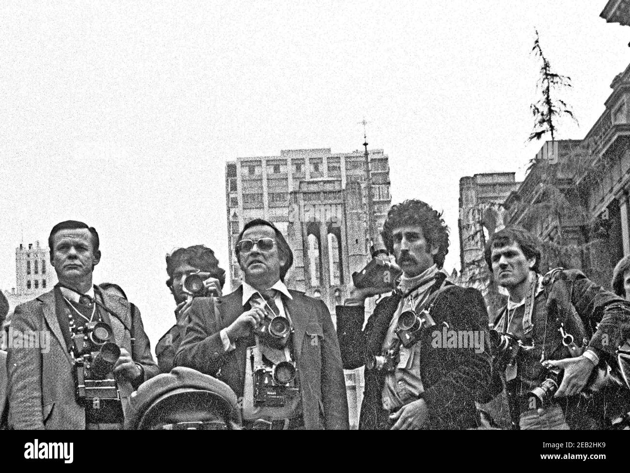 News photographers cover a demonstration in San Francisco against American involvement in Angola.  front row,  L to R; Gordan Stone, Sal Beder, Mthew Nathons, Richard Chatcuff.  In 1970s Stock Photo