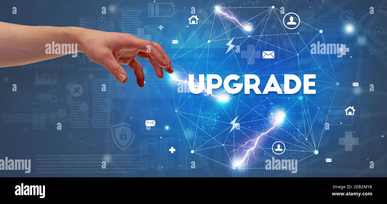 Hand pointing at UPGRADE inscription, modern technology concept Stock ...