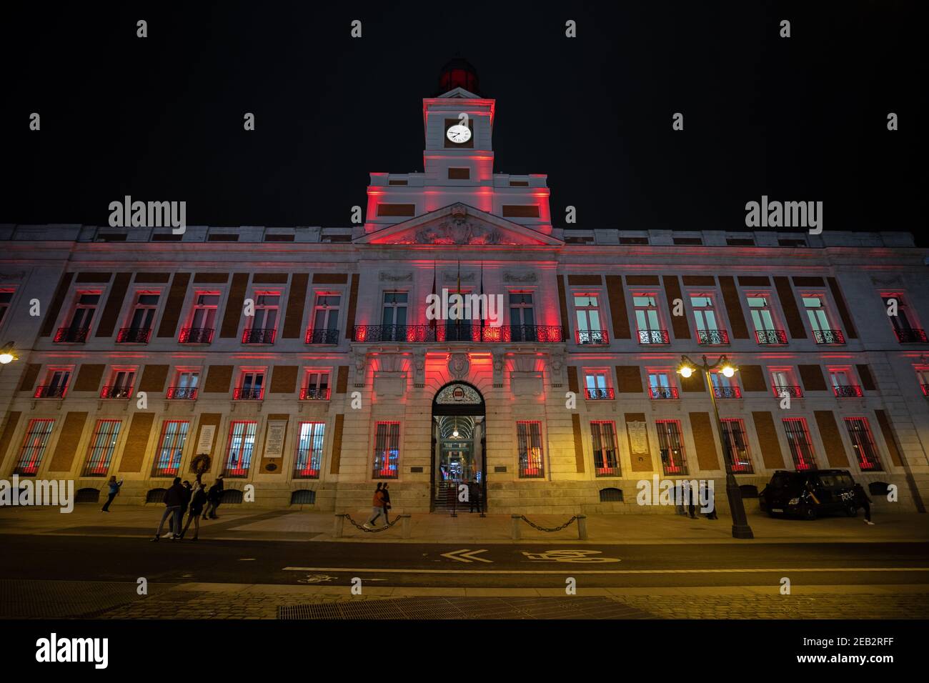 Madrid, Spain. 11th Feb, 2021. The Royal Post Office building is illuminated with red light to celebrate the Chinese Lunar New Year at Puerta del Sol in Madrid, Spain, Feb. 11, 2021. Credit: Meng Dingbo/Xinhua/Alamy Live News Stock Photo