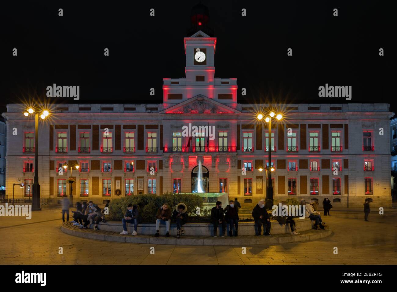 Madrid, Spain. 11th Feb, 2021. The Royal Post Office building is illuminated with red light to celebrate the Chinese Lunar New Year at Puerta del Sol in Madrid, Spain, Feb. 11, 2021. Credit: Meng Dingbo/Xinhua/Alamy Live News Stock Photo