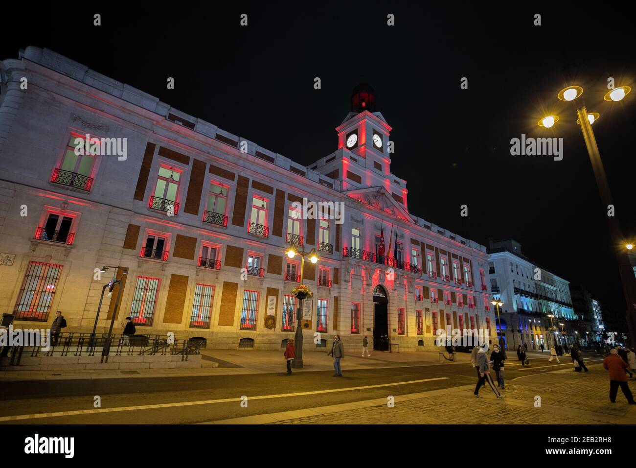 Madrid, Spain. 11th Feb, 2021. The Royal Post Office building is illuminated with red light to celebrate the Chinese Lunar New Year at Puerta del Sol in Madrid, Spain, Feb. 11, 2021. Credit: Meng Dingbo/Xinhua/Alamy Live News Stock Photo