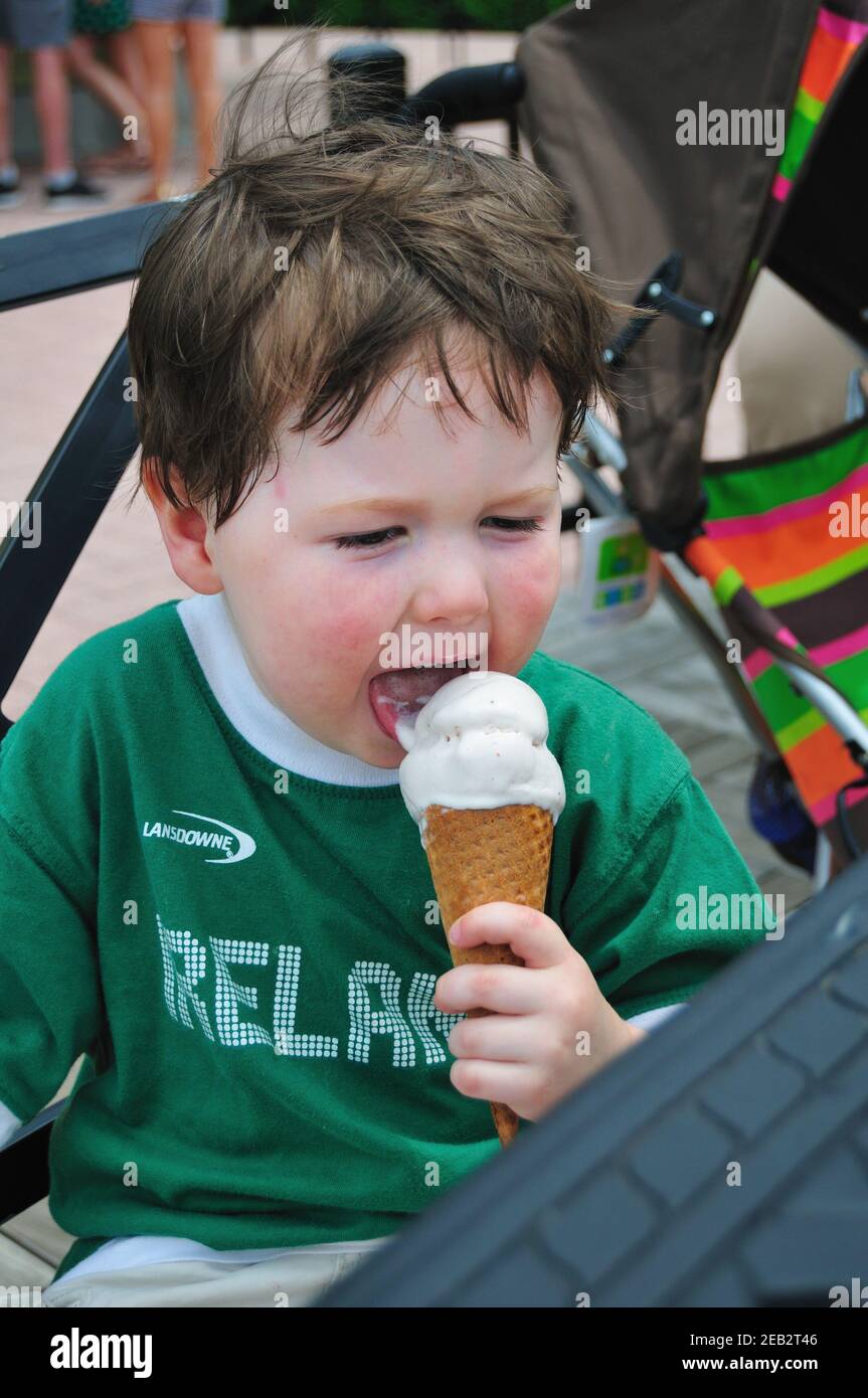 Chicago, Illinois, USA. Little boy enjoying an ice cream cone at the