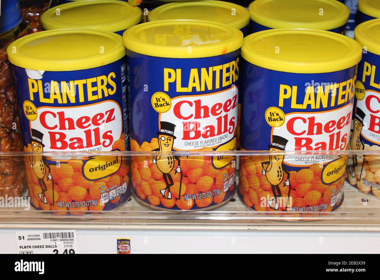 Planters Cheese Balls in a bright and colorful container shot closeup at a grocery store in Kansas on a metal shelf. Stock Photo