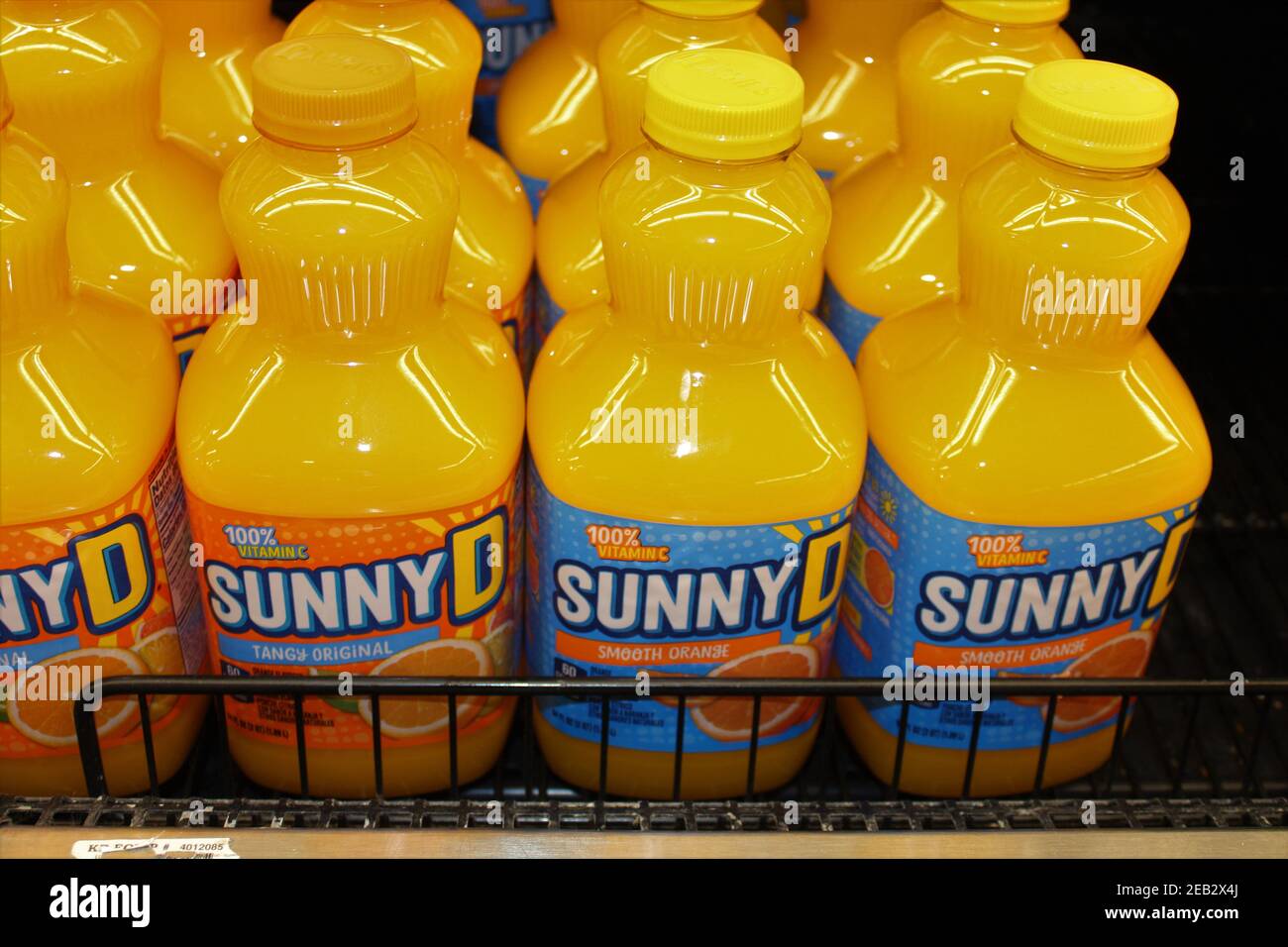 Sunny D orange drink shot closeup on a shelf in plastic containers at a