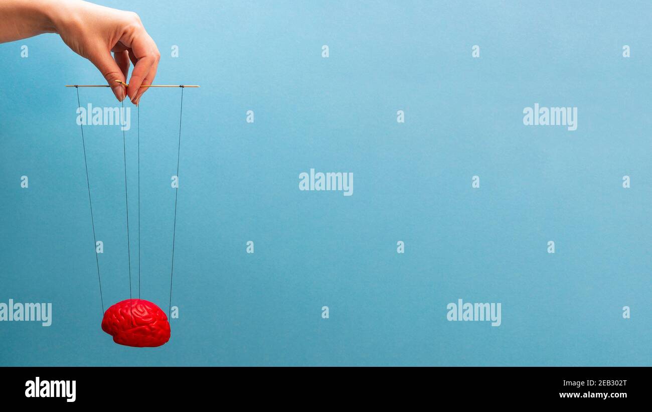 Blue Red Mind Control A red brain on a blue background, a hand that manipulates the mind like ...