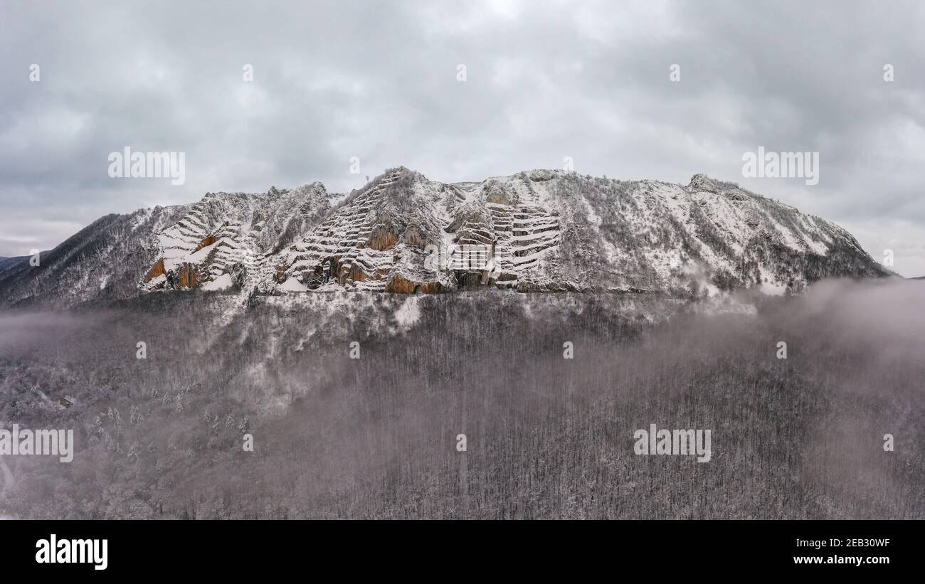 Aerial landscape from Hungar in Bukk Mountains. Scenic view about the Belko mountain andy Belapatfalva town's Cistercian abbey in winter time which co Stock Photo