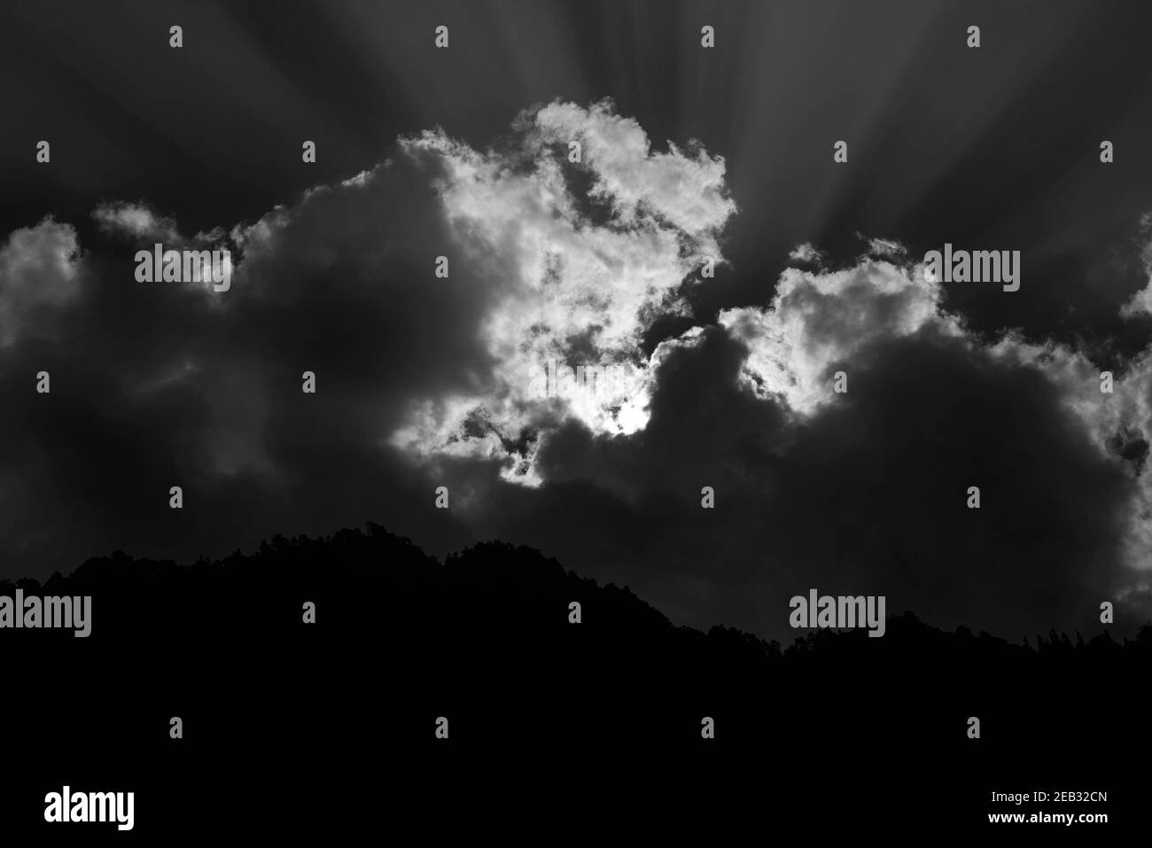 Black and white abstract shot of sun rays coming out of clouds Stock ...