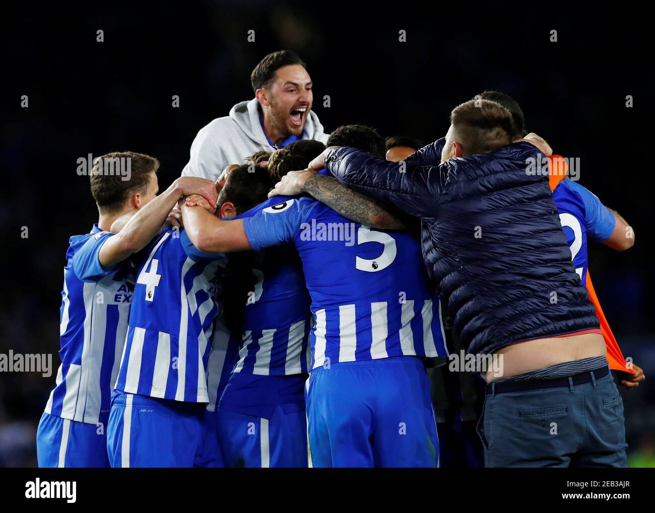 Soccer Football - Premier League - Brighton & Hove Albion v Manchester United - The American Express Community Stadium, Brighton, Britain - May 4, 2018   Brighton's players celebrate after the match as fans invade the pitch   REUTERS/Eddie Keogh    EDITORIAL USE ONLY. No use with unauthorized audio, video, data, fixture lists, club/league logos or 'live' services. Online in-match use limited to 75 images, no video emulation. No use in betting, games or single club/league/player publications.  Please contact your account representative for further details. Stock Photo