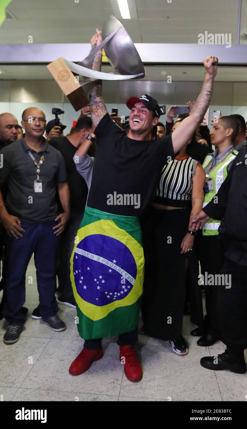 Surfing - Gabriel Medina WSL World Champion arrives in Brazil -  Sao Paulo, Brazil - December 22, 2018    Brazil's Gabriel Medina arrives at the airport and celebrates with the trophy   REUTERS/Paulo Whitaker Stock Photo