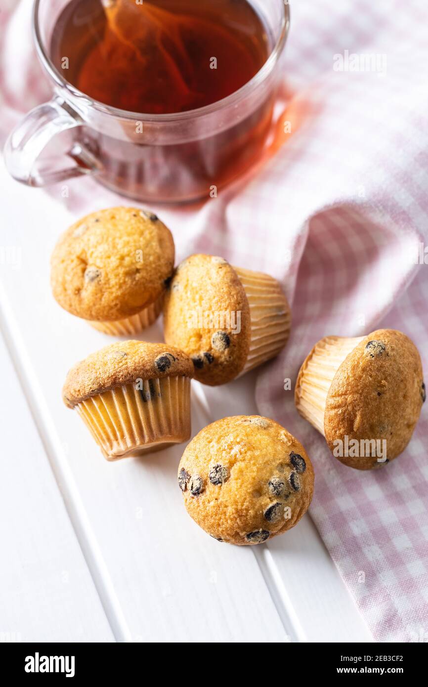 Vanilla muffins. Sweet cupcakes on white table. Stock Photo