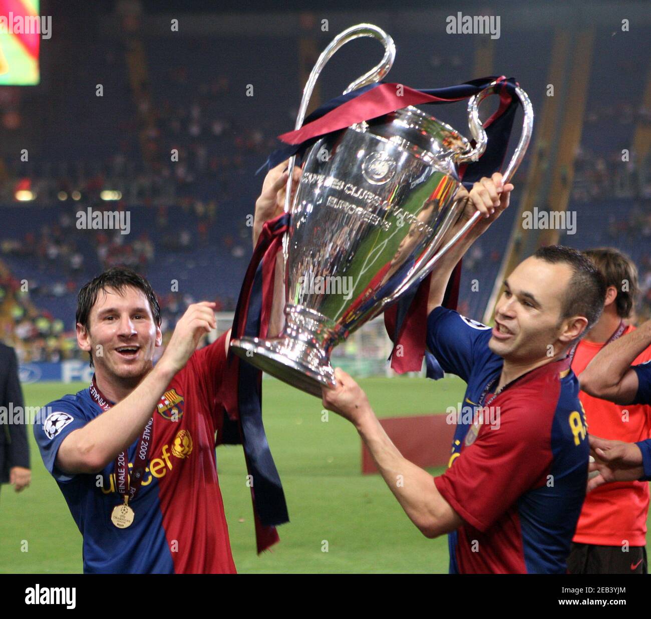 Football - Manchester United v FC Barcelona 2009 Champions League Final -  Olympic Stadium, Rome, Italy - 27/5/09 Barcelona's Lionel Messi (L) and  Andres Iniesta celebrate victory with the trophy Mandatory Credit: