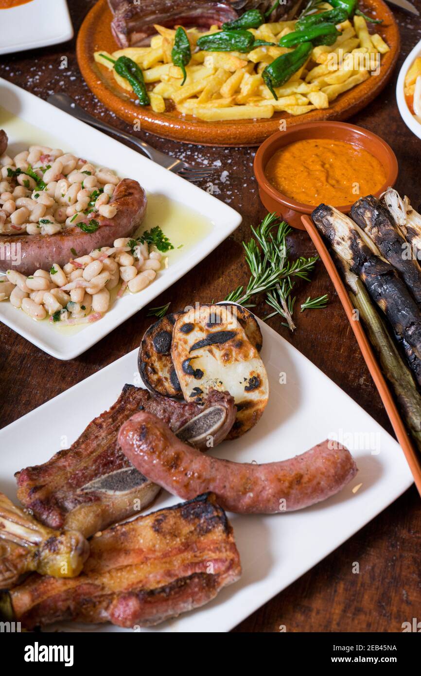 variety of grilled meat and dishes of Spanish cuisine Stock Photo Alamy