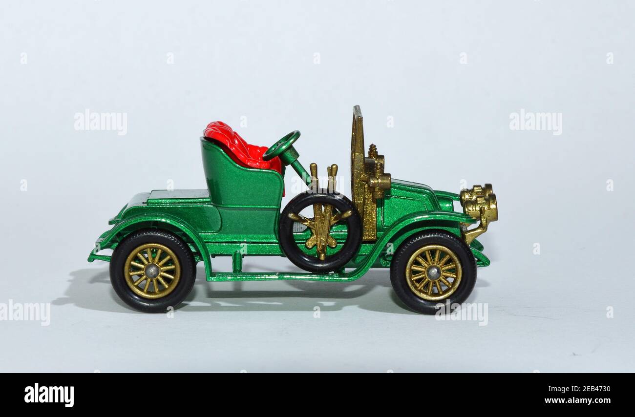 Toy diecast model of a Green 1911 Renault a Matchbox yesteryear product by Lesney with white background Stock Photo